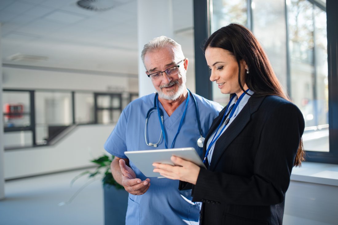 Healthcare operators reviewing practice performance together